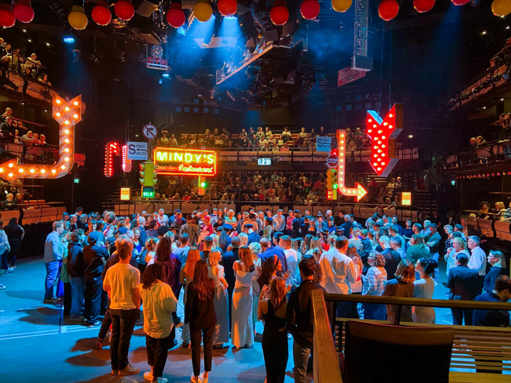 Image shows the inside of the Bridge Theatre in London, with a 