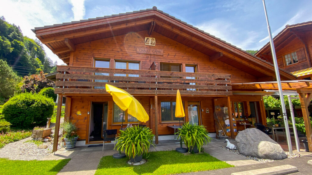 image shows a chalet in the Swiss alps