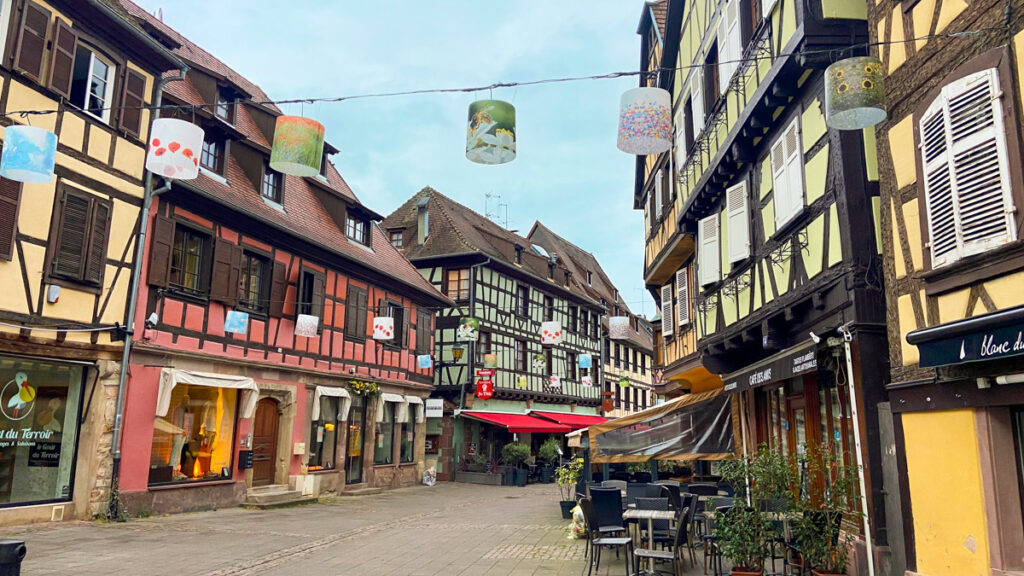 image shows a medieval style town in eastern france, with timbered buildings