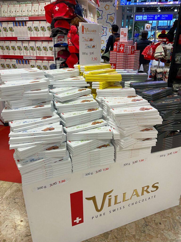 image shows a table labeled Villars, and on top are boxes of swiss chocolates