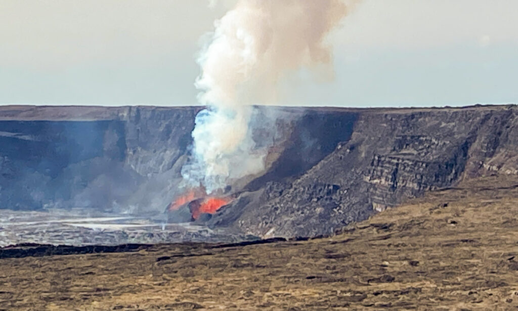 large crater on hawaii with a small dual fountain eruption 